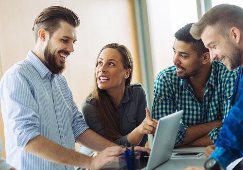 group of office employees smiling